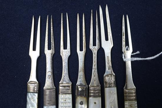 Seven 19th century and later silver and mother of pearl handled travelling forks a similar silver fruit knife and three other items.